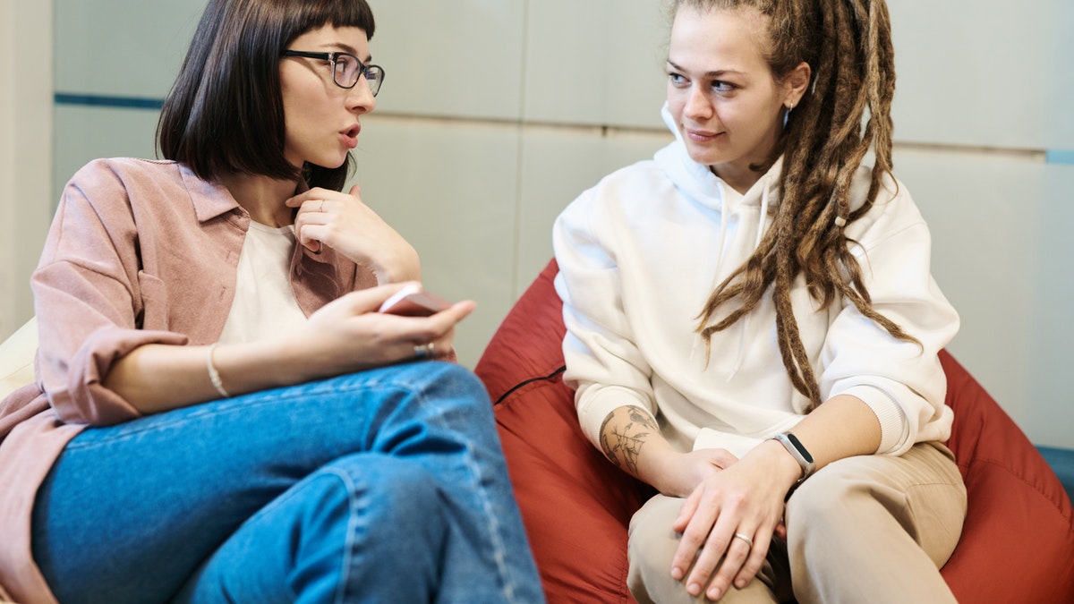 a photo of women talking about opioid addiction treatment
